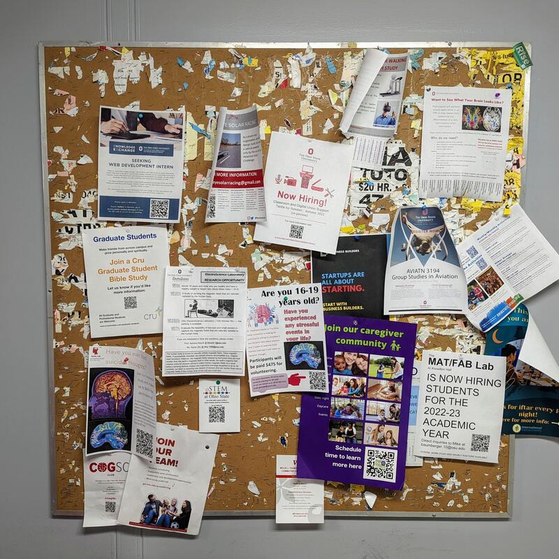 A bulletin board with notes on it